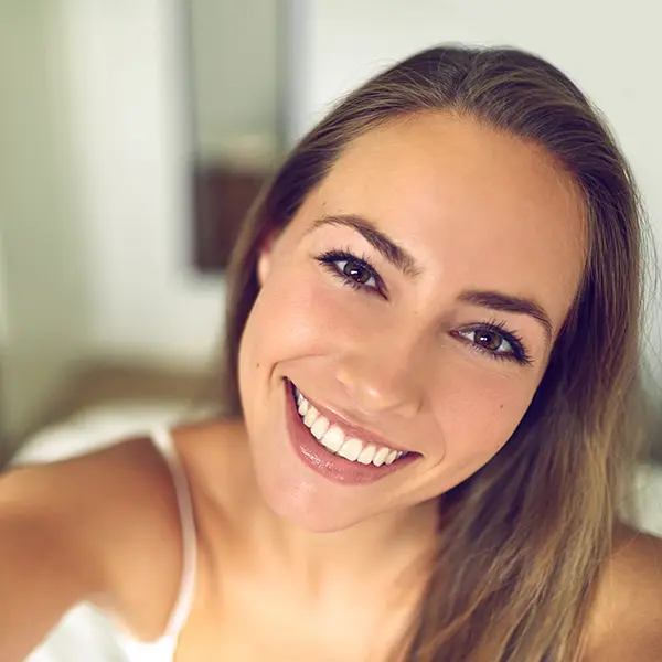 Smiling young woman representing a happy client proud of her new logo